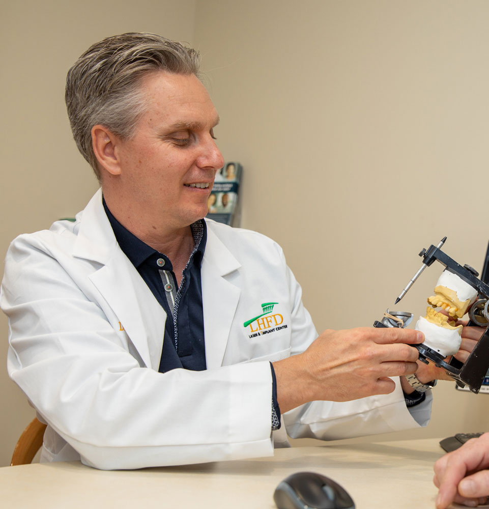 dr mooney discussing oral surgery procedure