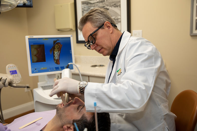 dr mooney performing dental procedure